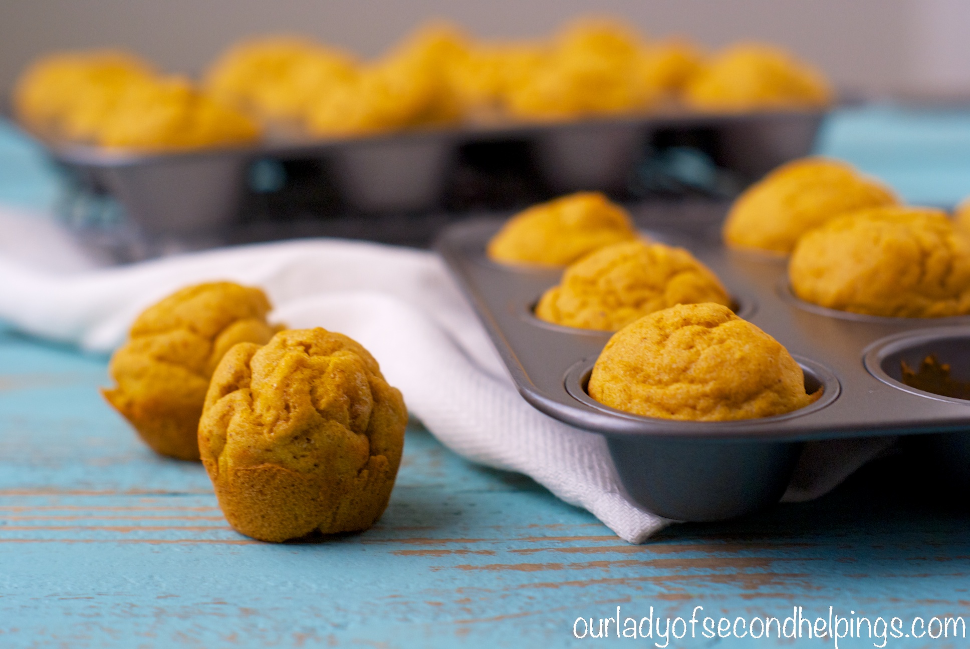 Pumpkin Spice Mini Muffins Mini Muffins on a blue table
