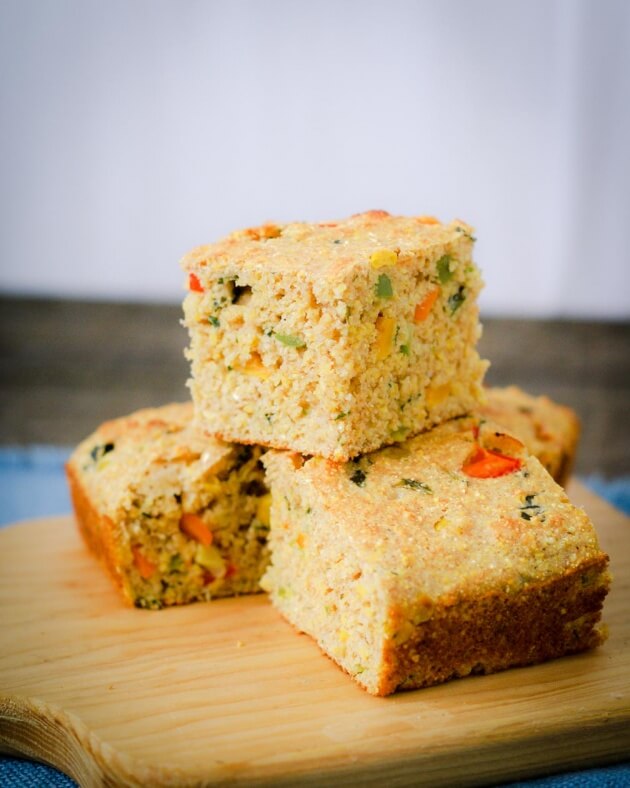 Eye catching confetti cornbread is a colorful addition to a barbecue with bursts of sweet corn and spicy jalapeños. You will love this quick & easy recipe.
