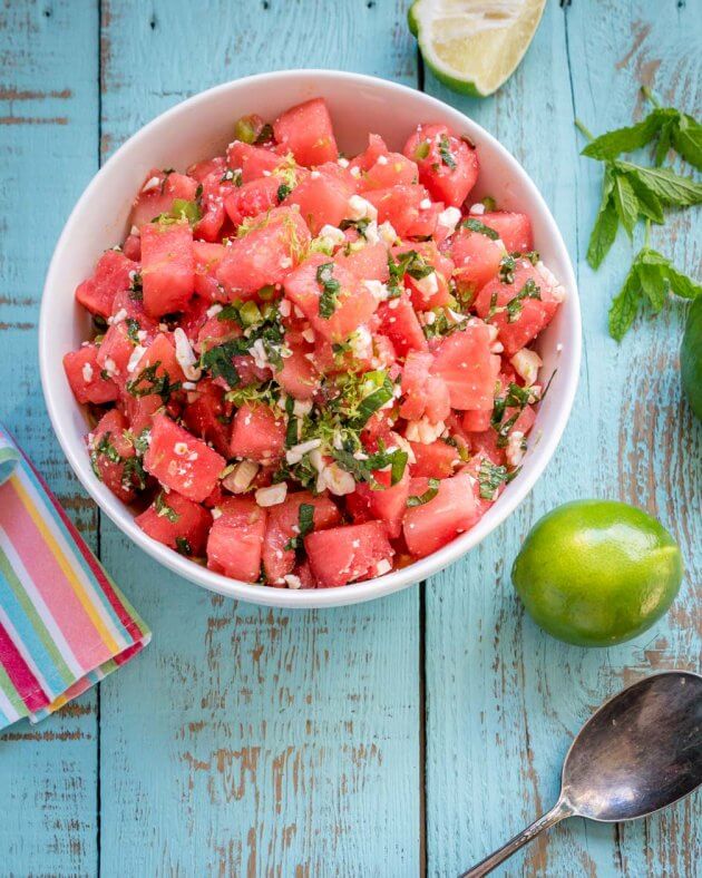 Watermelon salad with mint, feta, & spicy jalapenos - give this summer favorite a zesty twist. Quick & Easy recipe for picnics and barbecues.