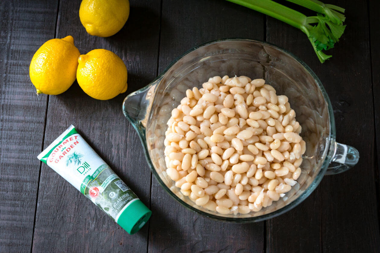 Thanks to the simple fresh flavors lemon dill navy bean salad has a lightness you might not expect from a bean salad. Quick & easy 15 minute no-cook recipe.