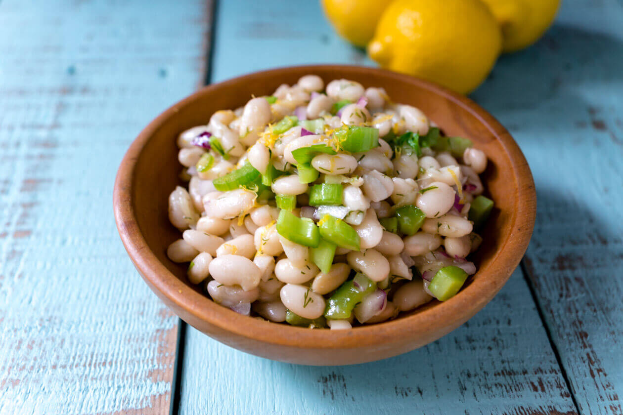 Thanks to the simple fresh flavors lemon dill navy bean salad has a lightness you might not expect from a bean salad. Quick & easy 15 minute no-cook recipe.