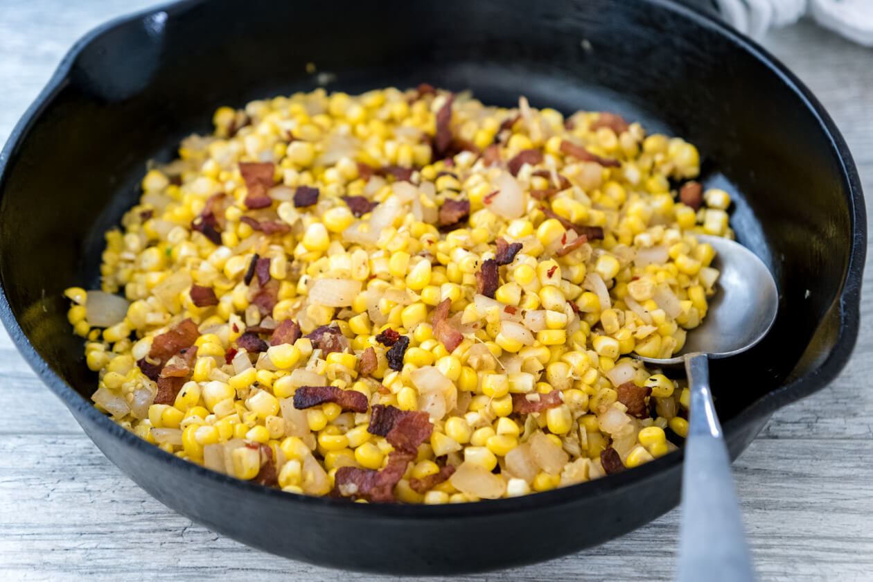 Tender fresh corn with crispy bacon is the exact right balance of salty with starchy sweet. An easy recipe for a healthy comfort food side dish.