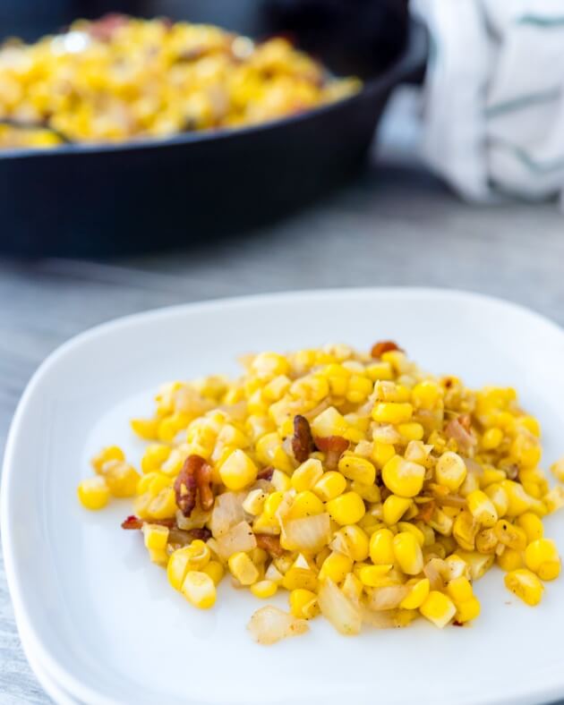 Tender fresh corn with crispy bacon is the exact right balance of salty with starchy sweet. An easy recipe for a healthy comfort food side dish.