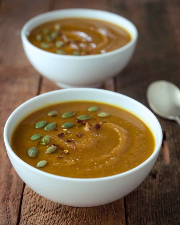Healthy pumpkin soup with roasted garlic is so indulgent and creamy it is hard to believe it is vegan. This is a perfect easy recipe to stay cozy throughout fall and winter.