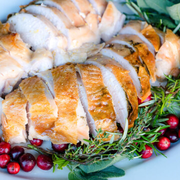 Roast turkey breast turns out tender and flavorful with this easy recipe using lemon-herb butter. Perfect for small holiday meals.