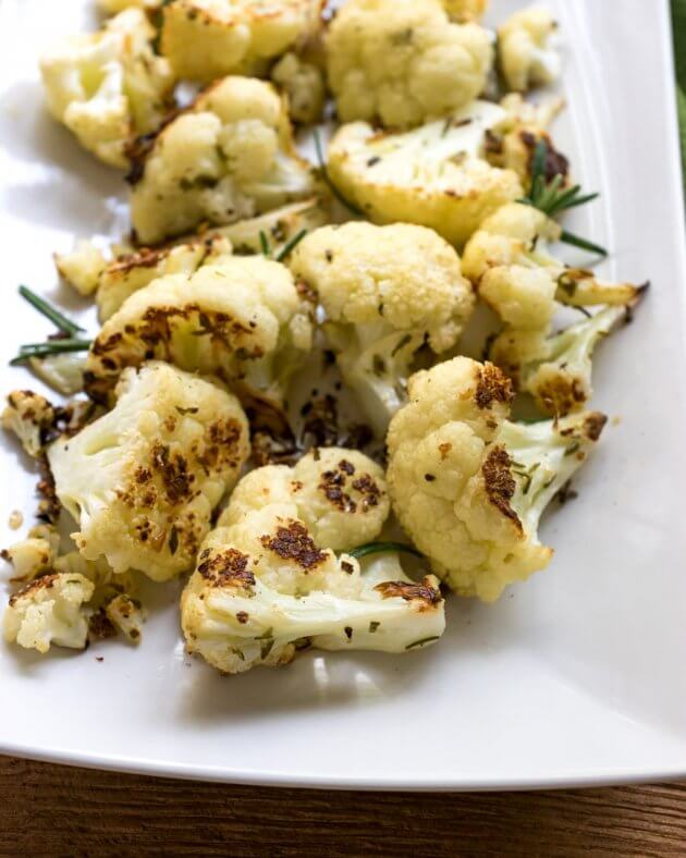 Roasted cauliflower with rosemary and sea salt is a perfectly elegant no-fuss side dish. A healthier alternative to potatoes and other starches.