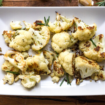 Roasted cauliflower with rosemary and sea salt is a perfectly elegant no-fuss side dish. A healthier alternative to potatoes and other starches.